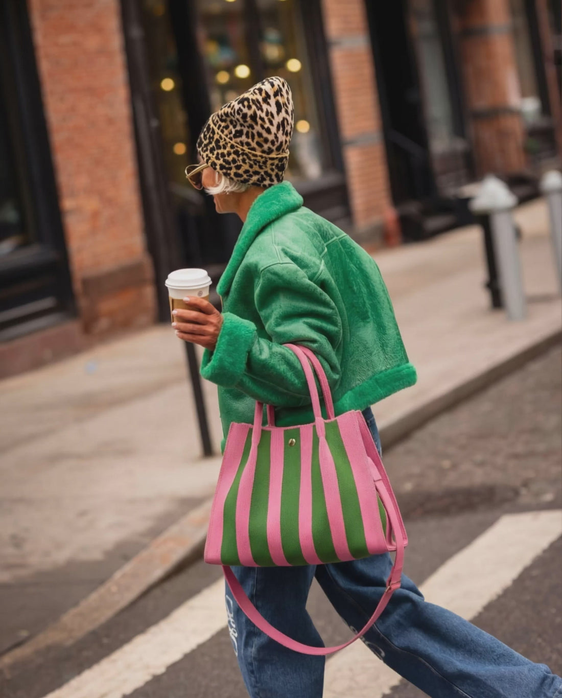 Woman walking with pink green city girl bag